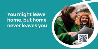Image of two women laughing and looking at a computer screen with the words You might leave home, but home never leaves you