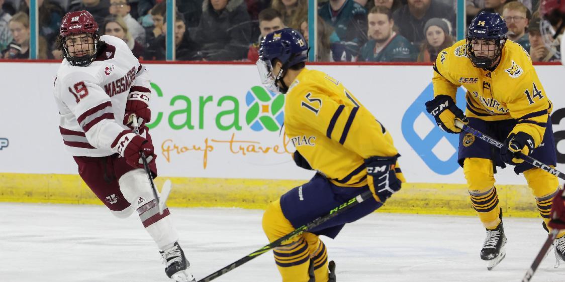 Two ice hockey teams playing ice hockey