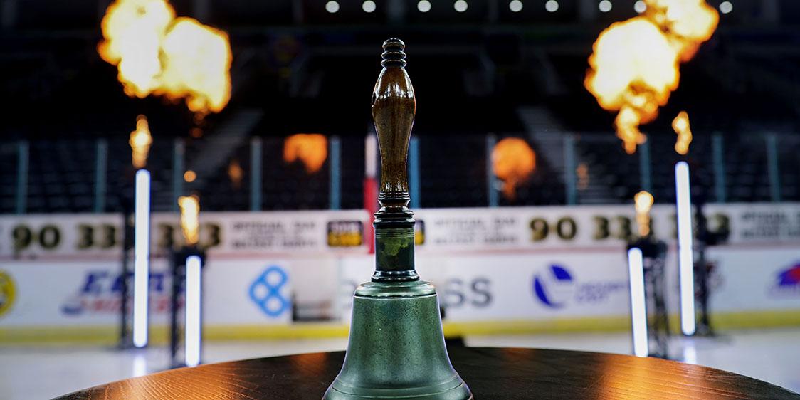 The Friendship Four Belpot Trophy displayed on a round wooden table.