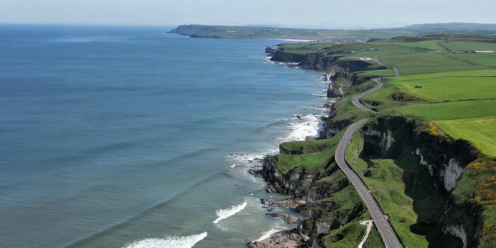 Image of a road winding along the North Coast of Northern Ireland