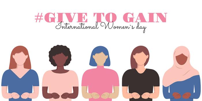 Illustration for International Women’s Day with the text “#Give To Gain – International Women’s Day” above five diverse women standing side by side