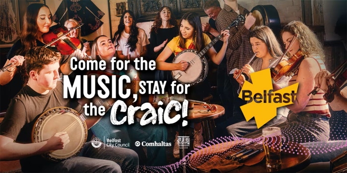 Traditional Irish musicians playing fiddle, banjo and flute in a lively pub session, with text reading “Come for the music, stay for the craic” and Belfast branding.